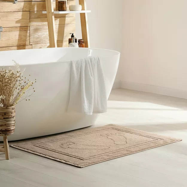 Dywanik bawełniany 50x70 SAMMY beżowy jednokolorowy z wzorem stóp